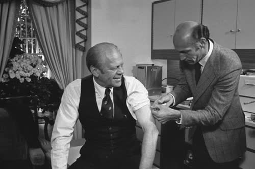 President Gerald Ford receiving the swine flu vaccine from his White House physician, Dr. William Lukash on October 14, 1976. Image: David Hume Kennerly. Source: Gerald R. Ford Presidential Library and Museum.